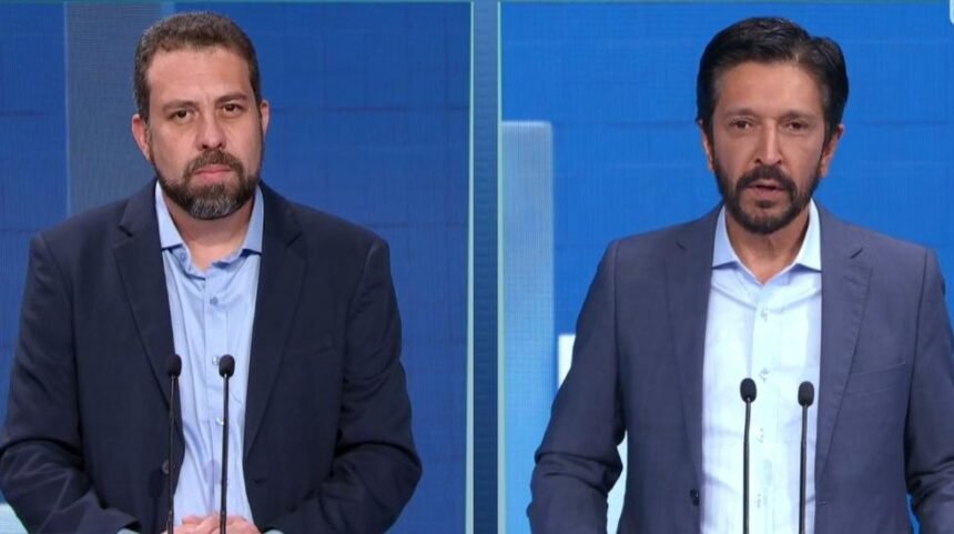 Guilherme Boulos e Ricardo Nunes durante debate promovido pelo SBT e portal Terra, no primeiro turno — Foto: Reprodução/SBT/Terra